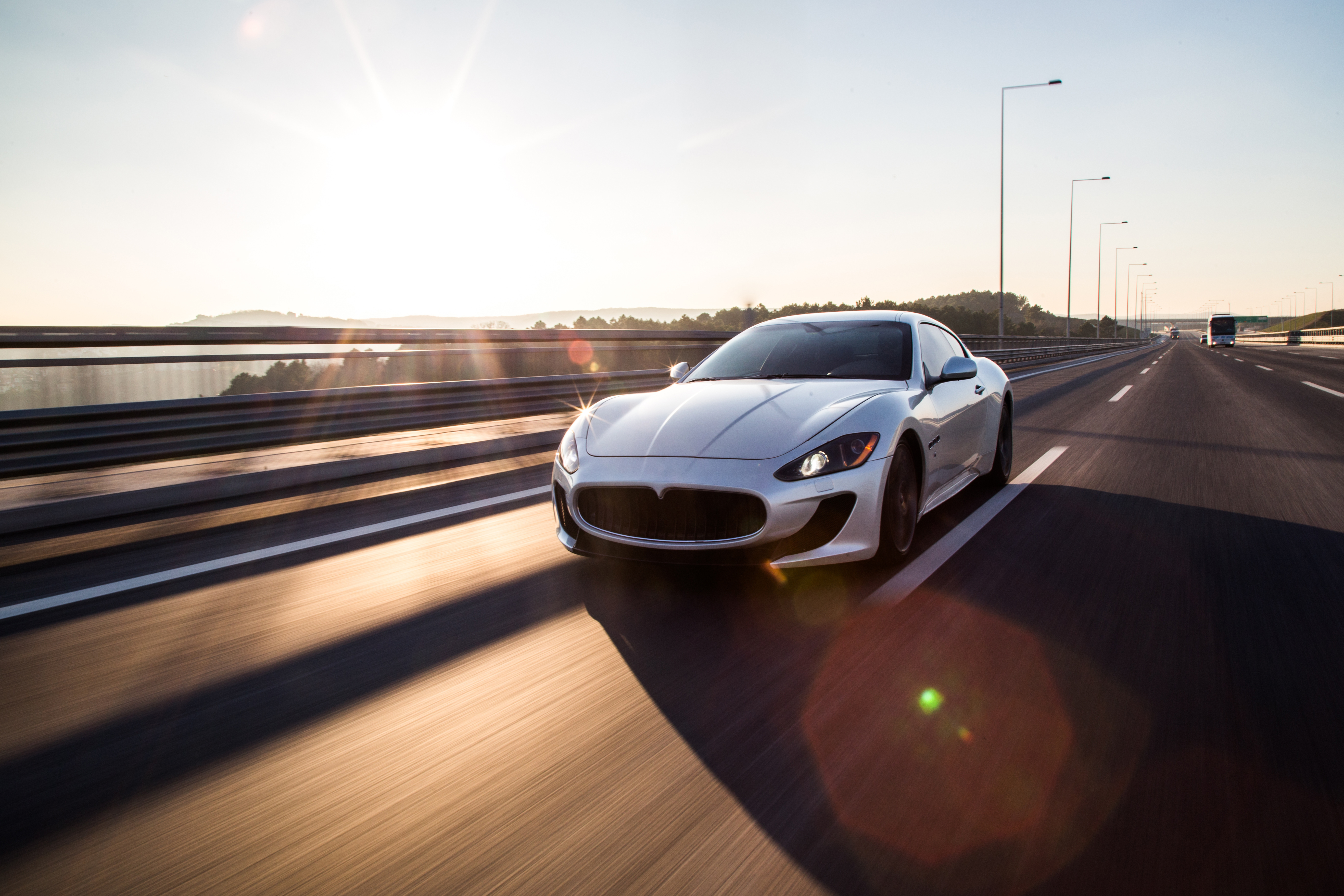 https://img.moneyduck.com/article_attachment/1663904356-front-view-high-speed-silver-sport-car-driving-highway.jpg
