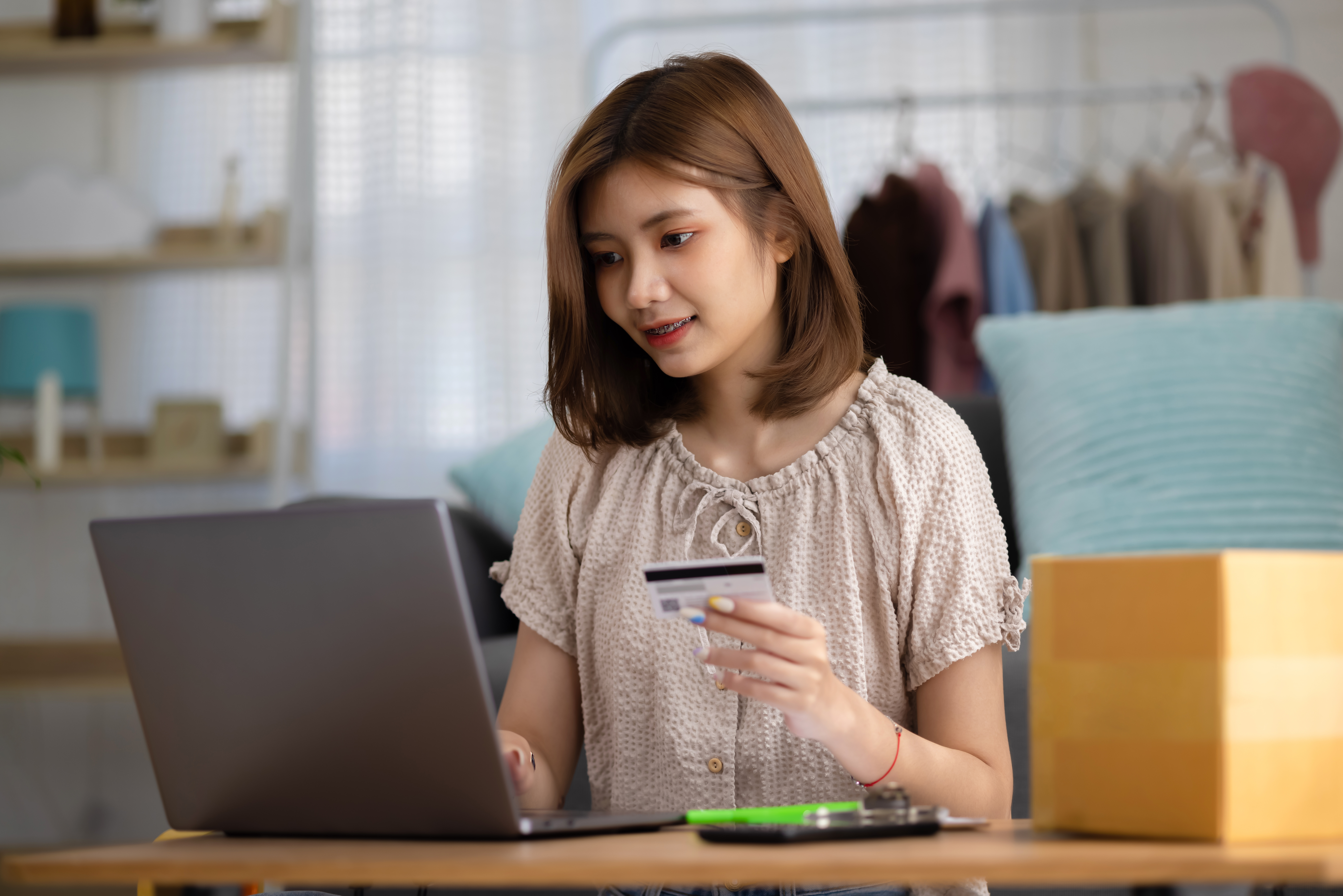 https://img.moneyduck.com/article_attachment/1664256214-young-asian-woman-using-credit-card-shopping-website-by-laptop-computer-online-shopping-ecommerce-concept.jpg