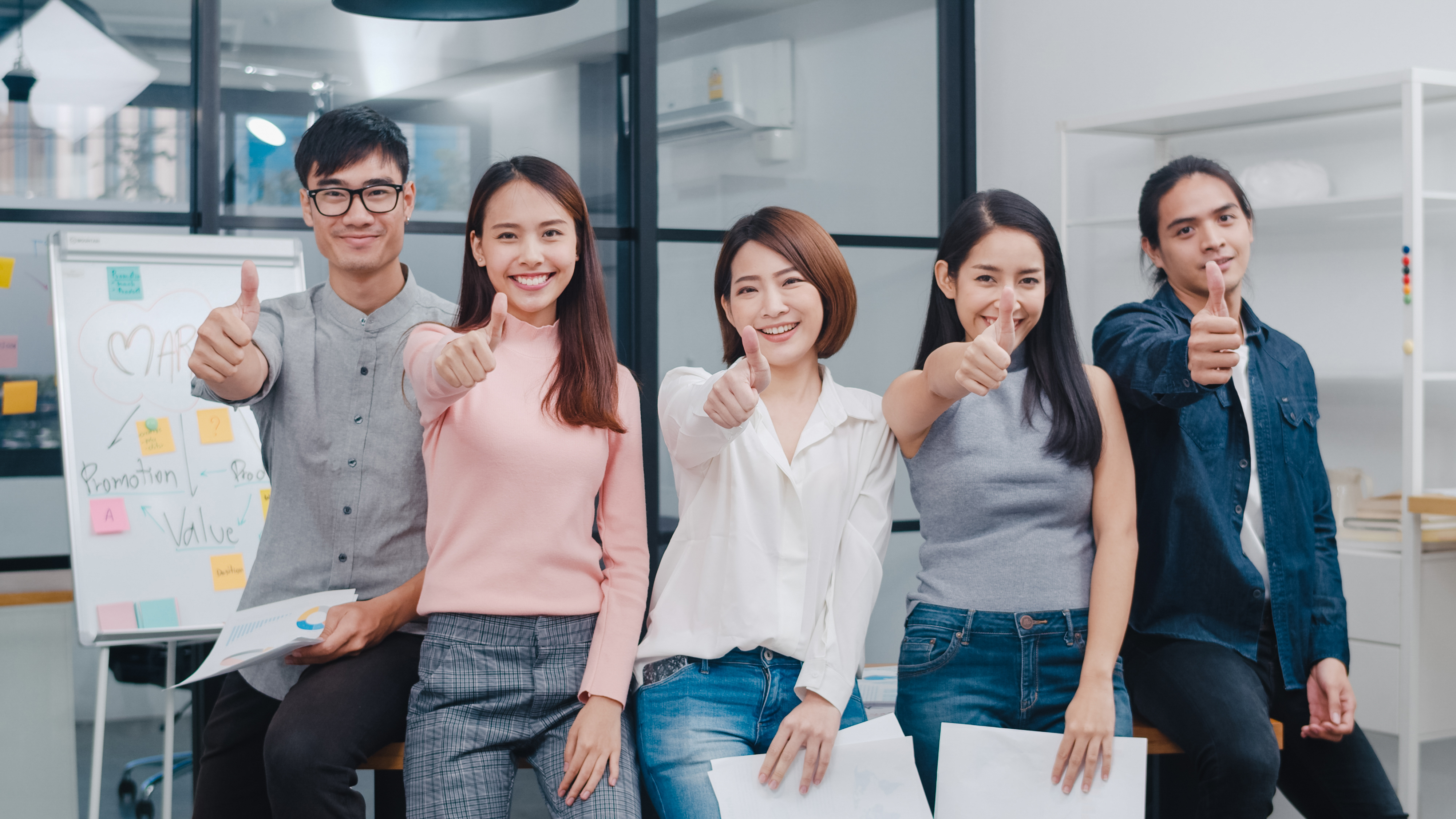 https://img.moneyduck.com/article_attachment/1664875390-group-asia-young-creative-people-smart-casual-wear-smiling-thumbs-up-creative-office-workplace.jpg