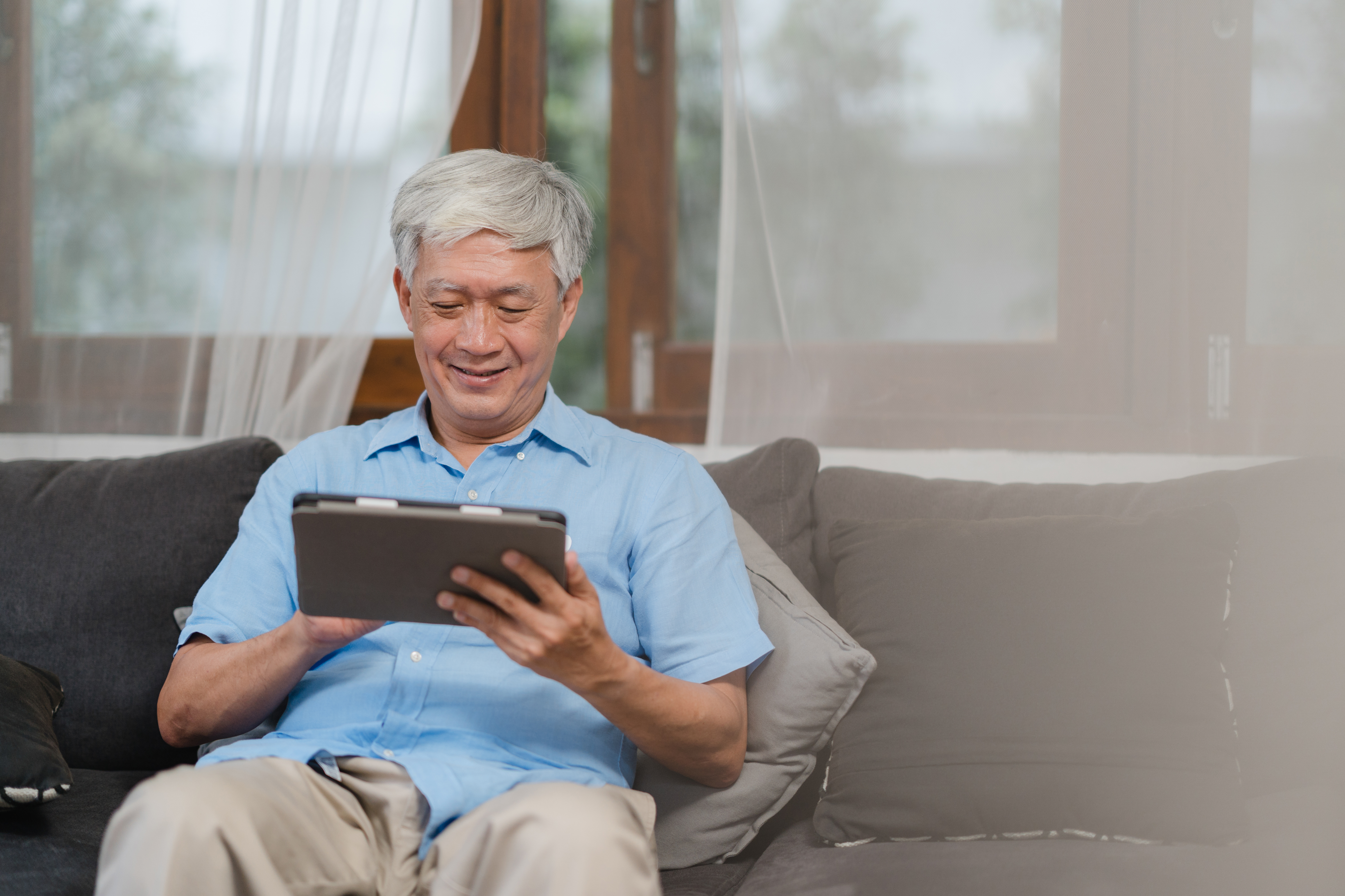 https://img.moneyduck.com/article_attachment/1671171907-asian-senior-men-using-tablet-home-asian-senior-chinese-male-search-information-about-how-good-health-internet-while-lying-sofa-living-room-home-concept.jpg