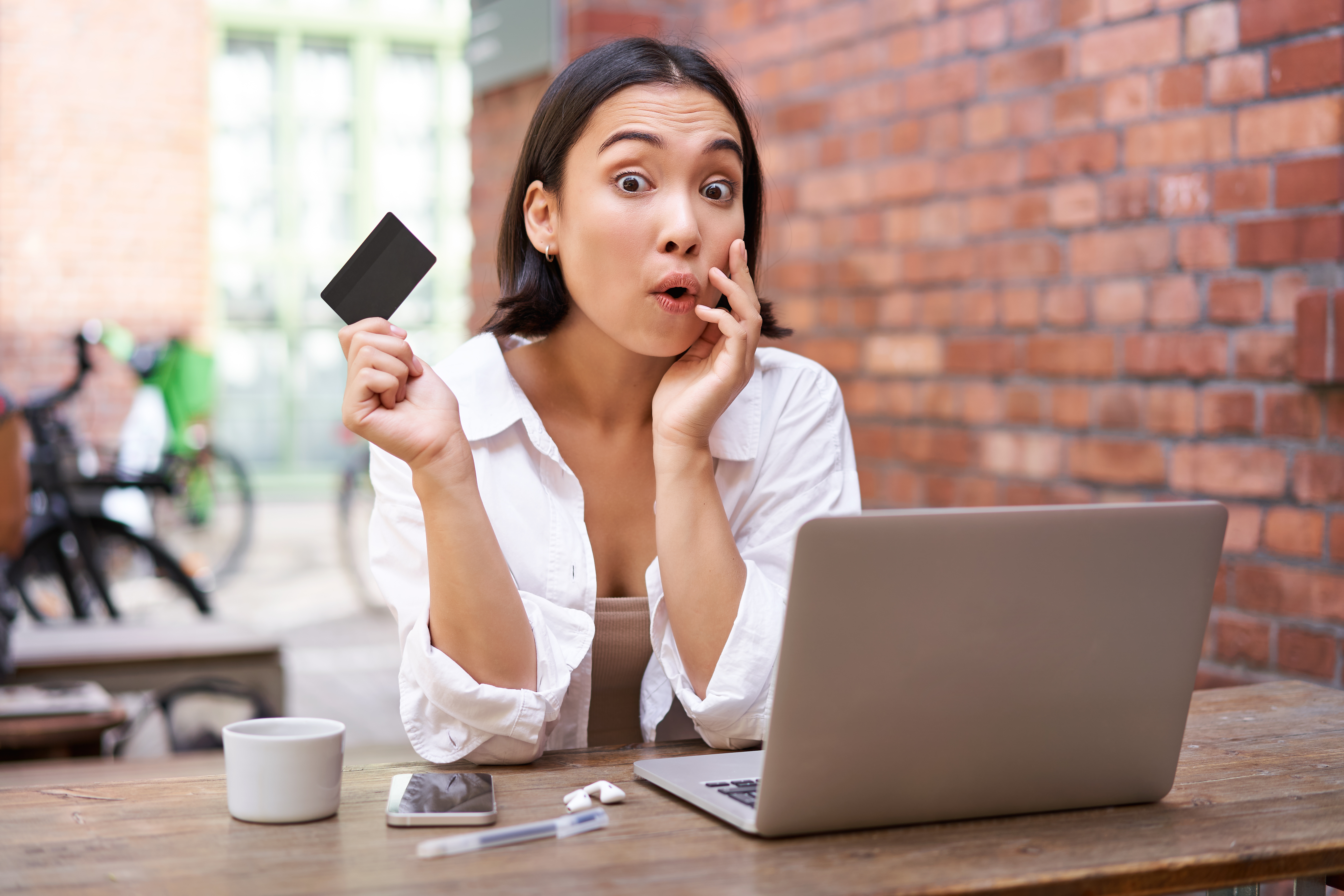 https://img.moneyduck.com/article_attachment/1677126873-stylish-young-asian-woman-doing-shopping-online-sitting-with-credit-card-laptop-buying-intern.jpg