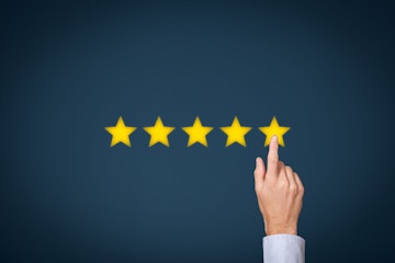 Stock Photo - Increase rating, evaluation and classification concept. Businessman click on five yellow stars to increase rating of his company.